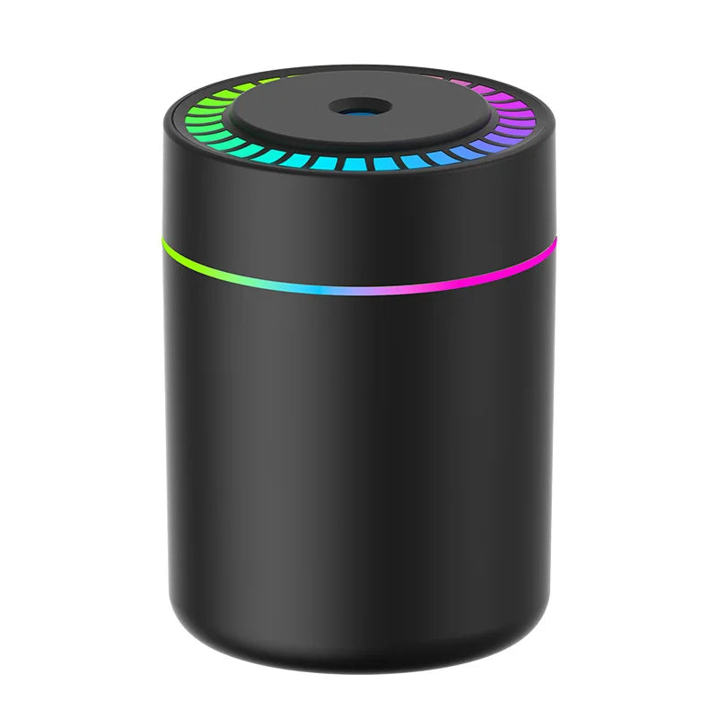 Black cylindrical car aroma diffuser with rainbow LED ring light, product-only shot on white background