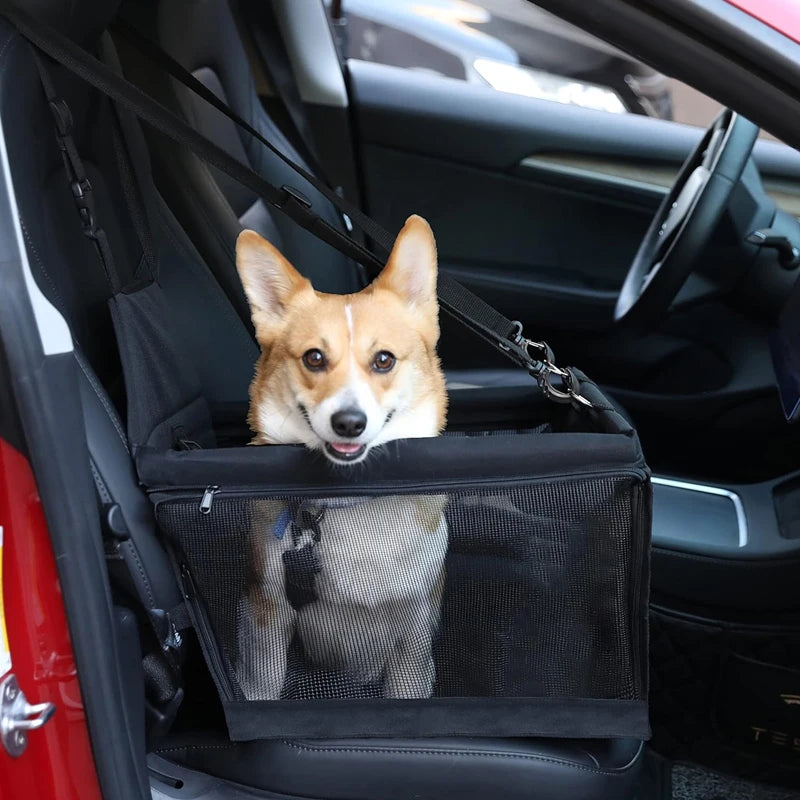 Corgi sitting in a black Hanging Pet Car Seat fitted to a car front passenger seat