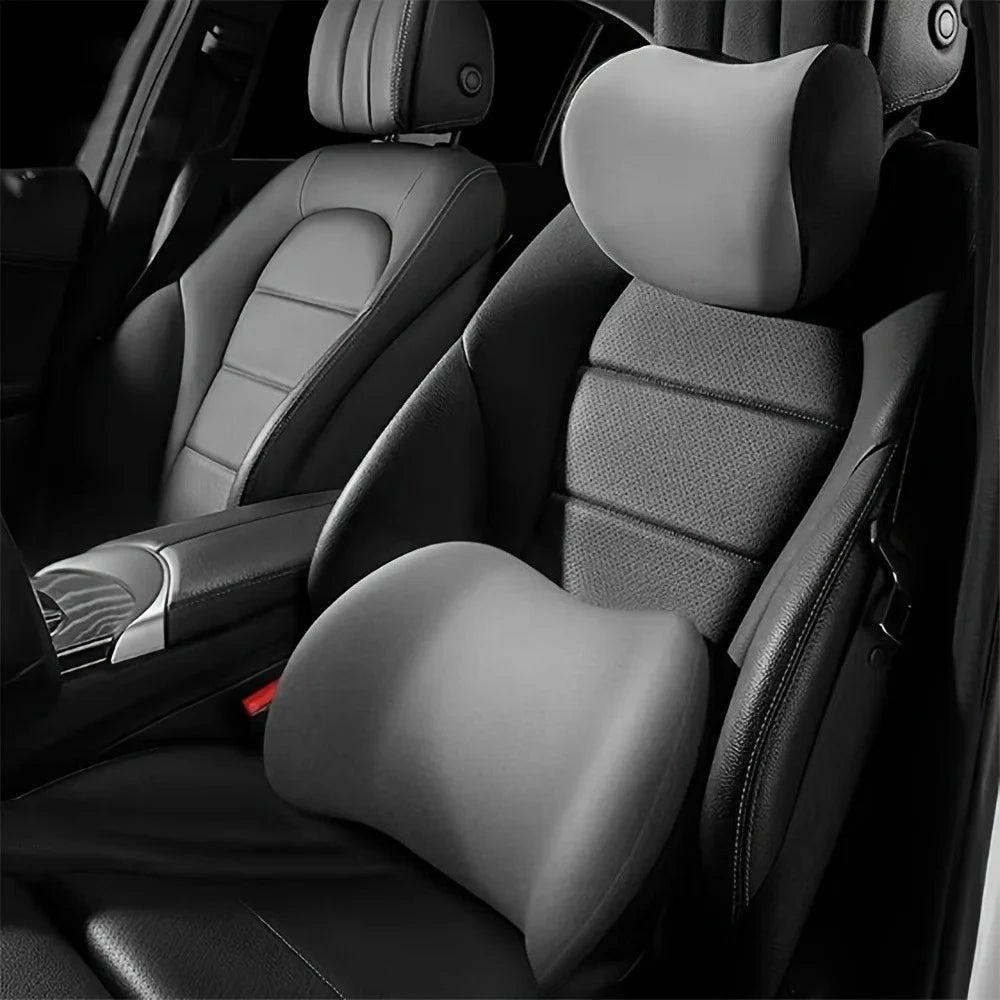 Memory Foam Car Headrest Neck Pillow and Lumbar Support Cushion fitted to a grey and black car seat interior