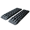 Pair of black Heavy-Duty Recovery Tracks with raised traction cleats and moulded grab handles on a white background