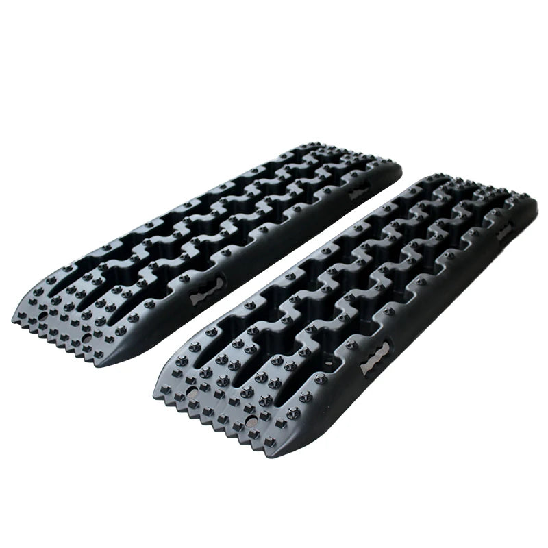 Pair of black Heavy-Duty Recovery Tracks with raised traction cleats and moulded grab handles on a white background