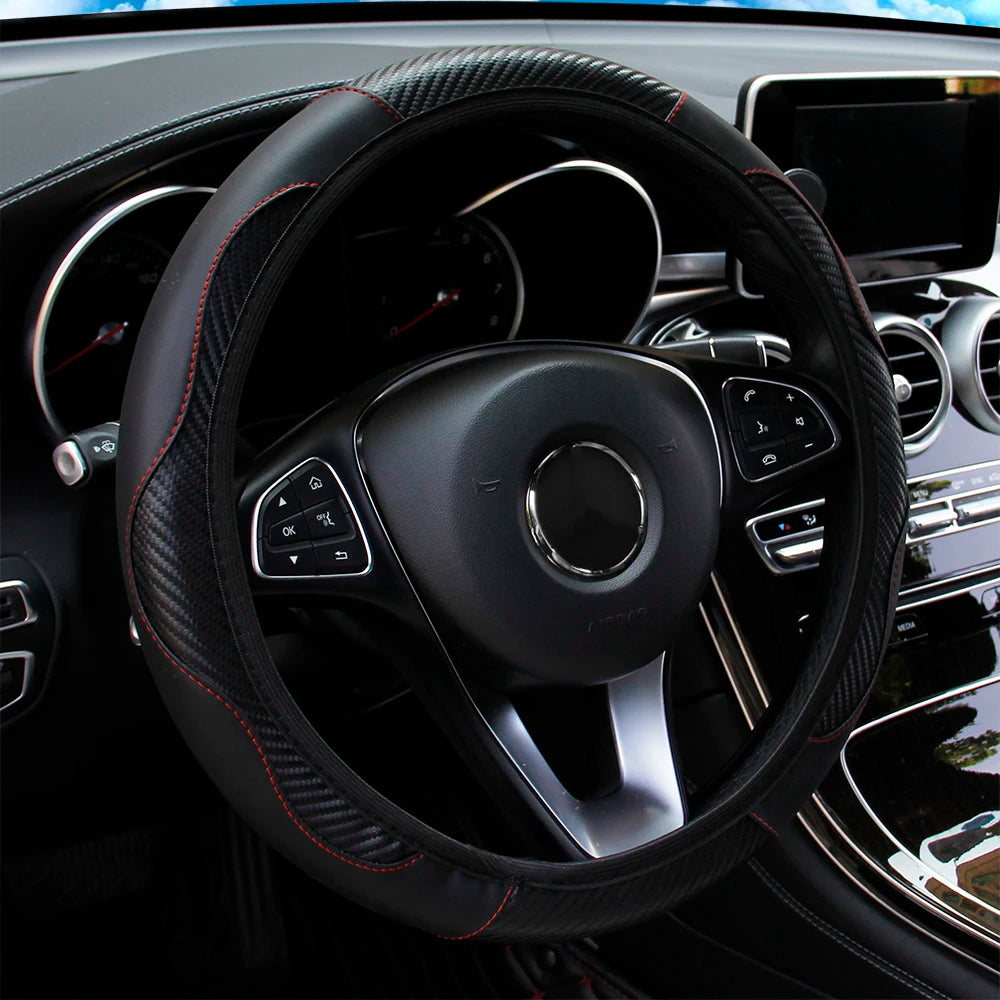 Black PU leather steering wheel cover with red stitching fitted to a car steering wheel with multifunction buttons