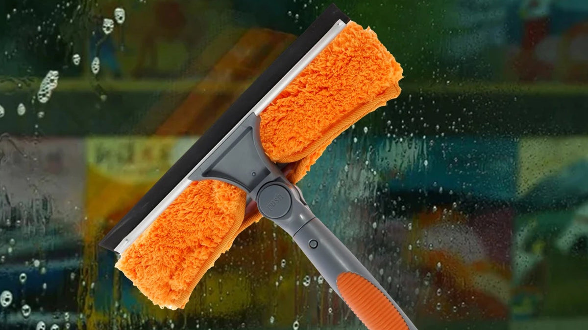 Telescopic Window Squeegee cleaning a rainy window with badges for ultra-long, multifunctional, detachable and wide range