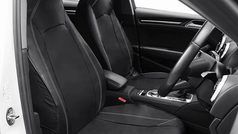 Leather Bucket Seat Covers installed close-up on front seat inside white vehicle door frame