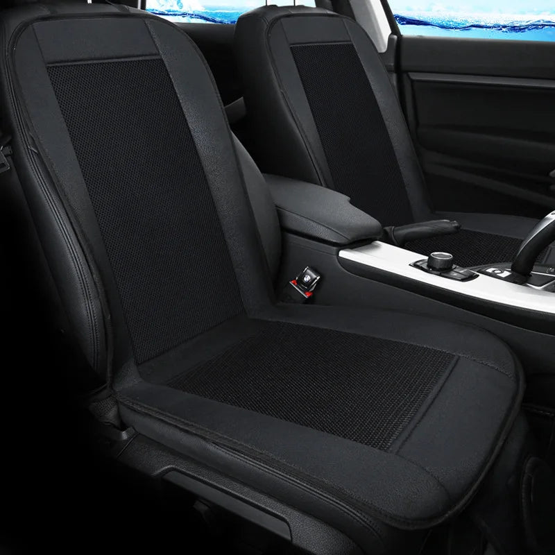 Black ventilated car seat cushion installed on vehicle rear seat