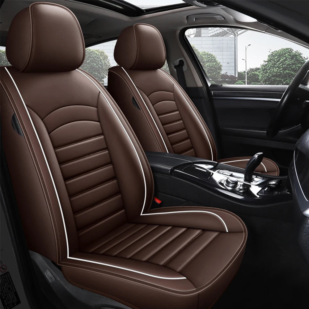 Brown Leather Car Seat Cover installed on car front seats with cream piping viewed through open door