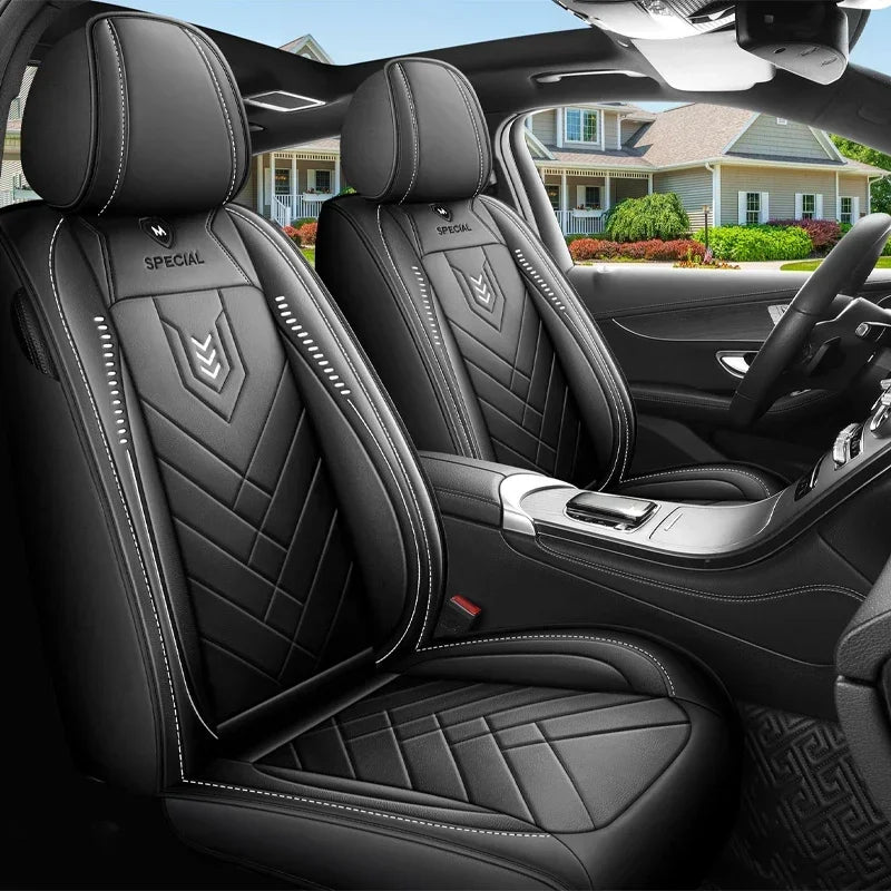 Black Leather-Look Front Pair Car Seat Covers fitted in a vehicle interior