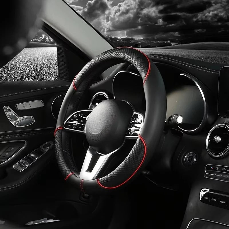 Diamond Leather Steering Wheel Cover with red stitching installed on a car steering wheel, side angle night view
