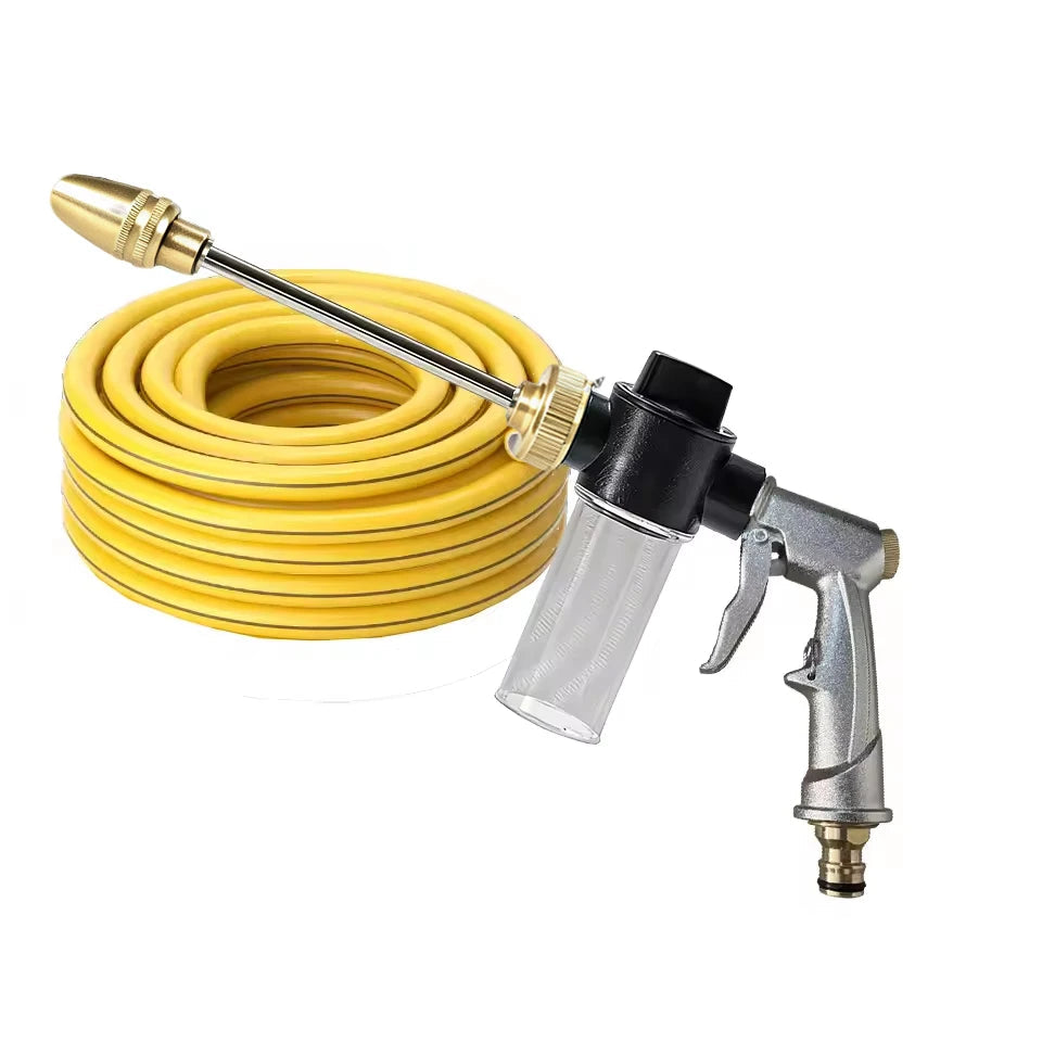 Rotating Foam Wash Gun with brass nozzle and silver metal grip shown with a coiled yellow garden hose