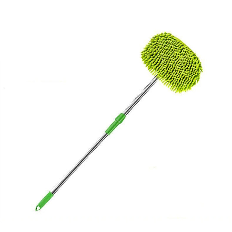 Green microfiber cleaning brush with extendable handle on a white background