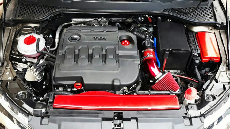 Collage of a car engine with red and blue components