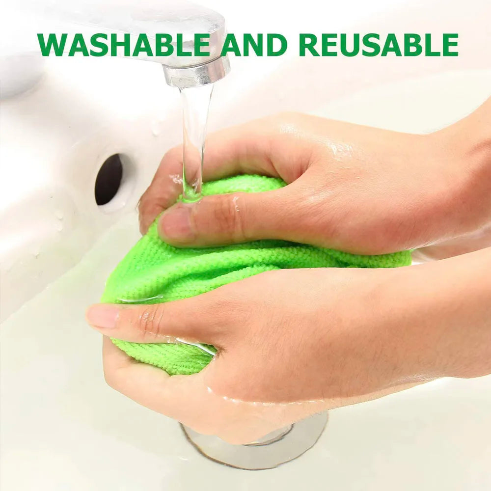 Washable and reusable microfibre pad being rinsed clean under running water