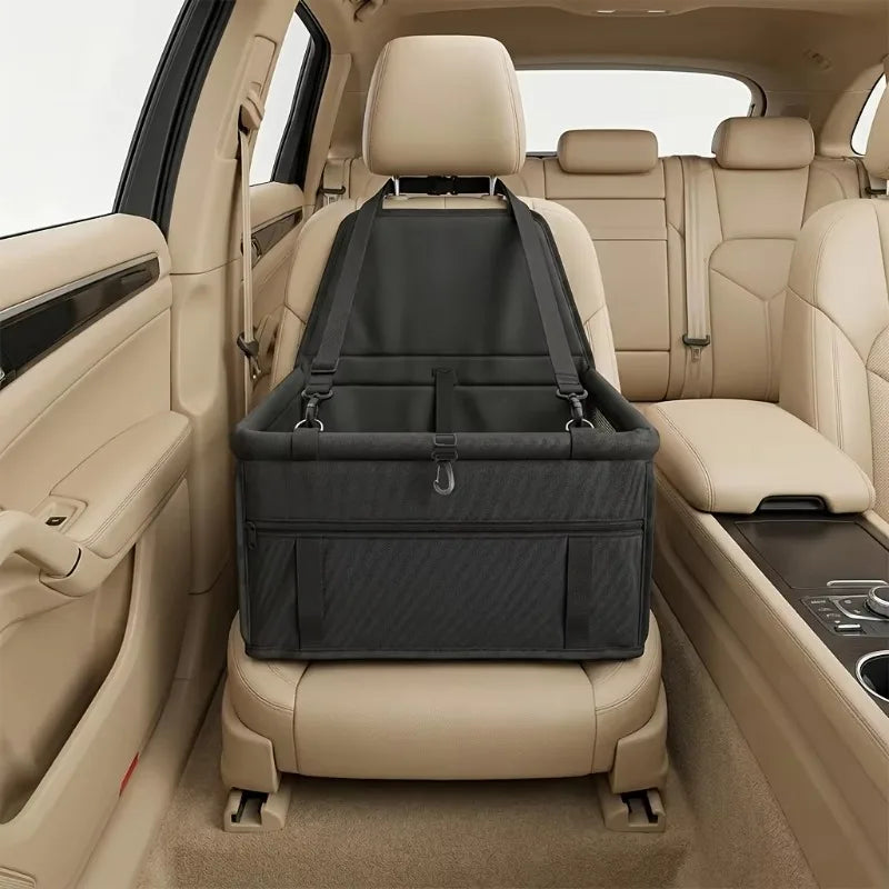 Mesh Pet Booster Seat hanging from the headrest of a beige car passenger seat, front view