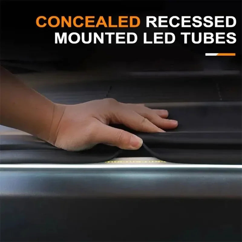 Hand pressing on a concealed recessed mounted LED tube light strip installed along a car boot seal