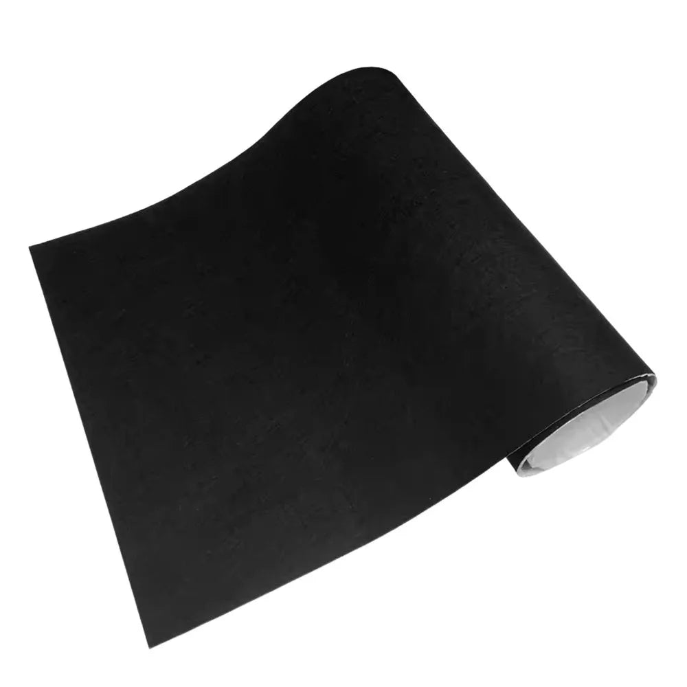Black self-adhesive felt lining sheet partially rolled to show white adhesive backing