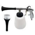 Pneumatic tornado detail cleaning gun with white cleaning fluid bottle and detail brush attachment on a white background
