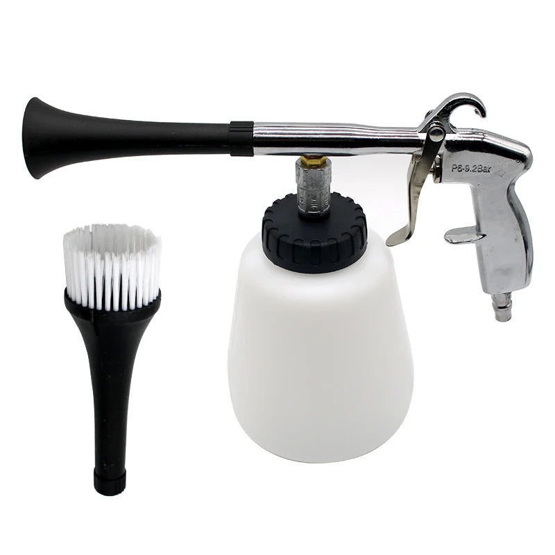 Pneumatic tornado detail cleaning gun with white cleaning fluid bottle and detail brush attachment on a white background