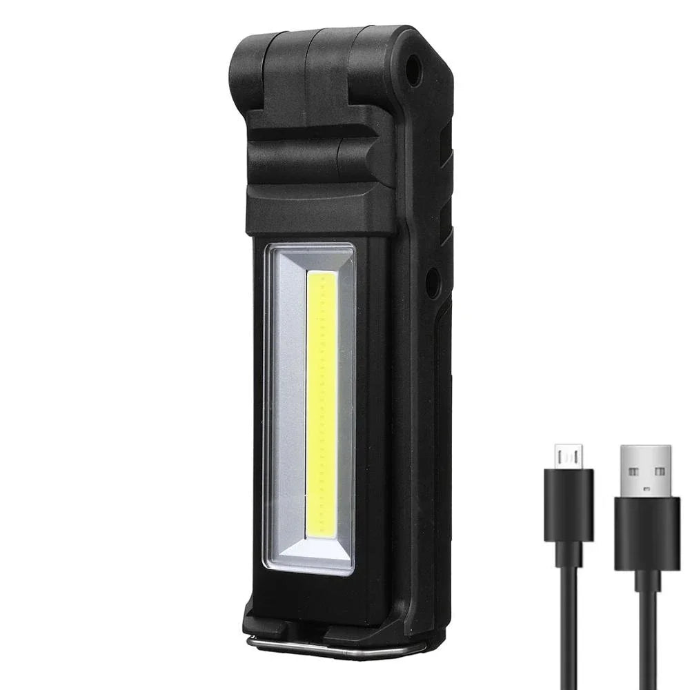 Rechargeable COB Work Light in stealth black with USB charging cable illuminated on a white background