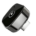 Mini Wireless CarPlay Adapter in glossy black and chrome with USB-A connector on a white background