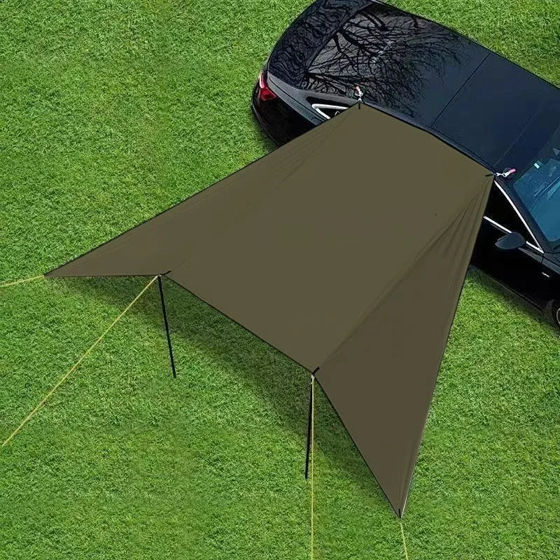 Expedition Side Sunshade deployed on grass beside a black car, viewed from above