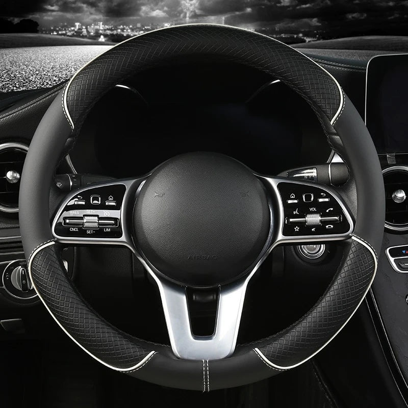 Diamond Leather Steering Wheel Cover in black leather with white stitching, installed on a steering wheel