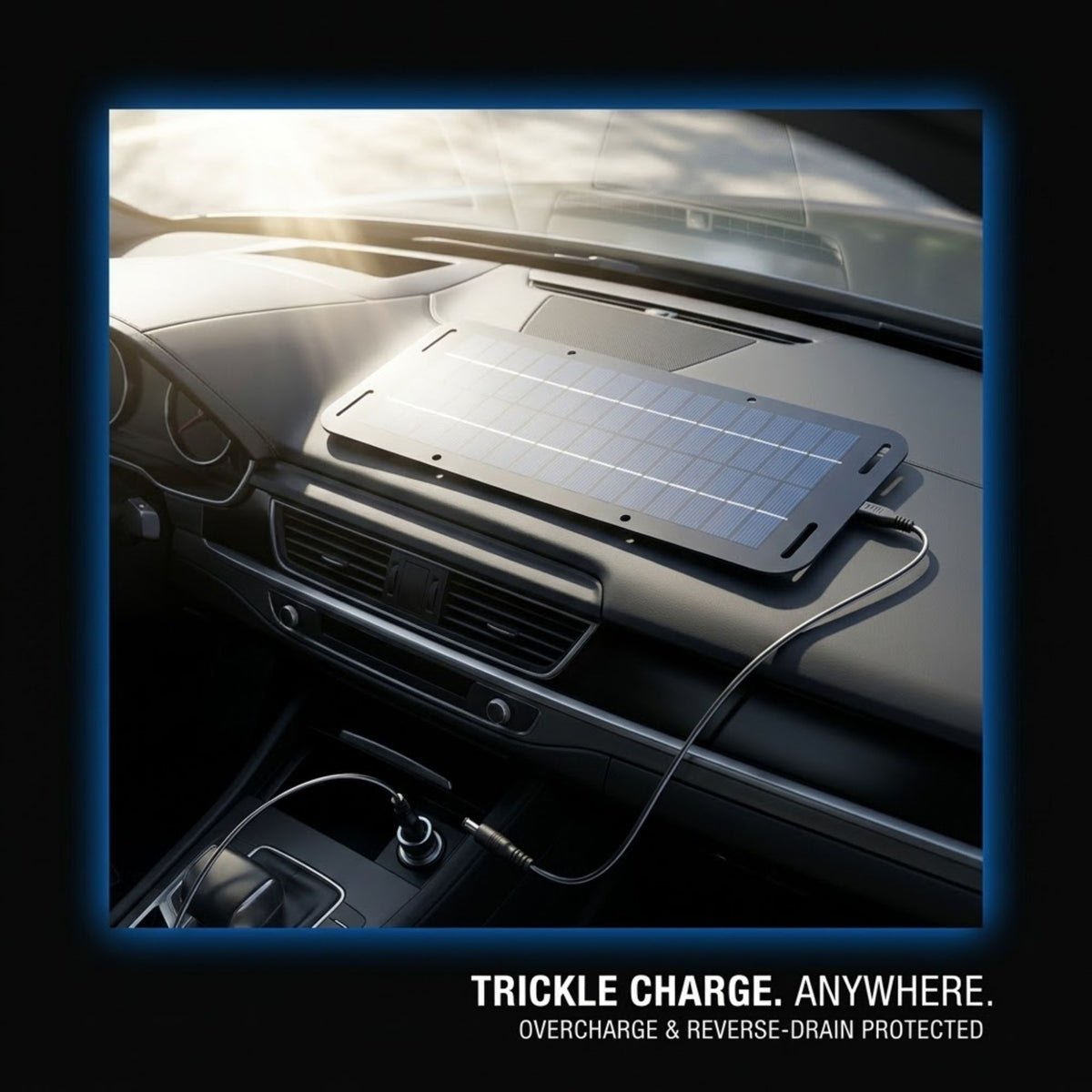 A rectangular solar trickle charger with a grid-patterned surface rests on a car dashboard, connected by a cable to a charging port. The image is framed with a blue border and includes the text 'TRICKLE CHARGE.