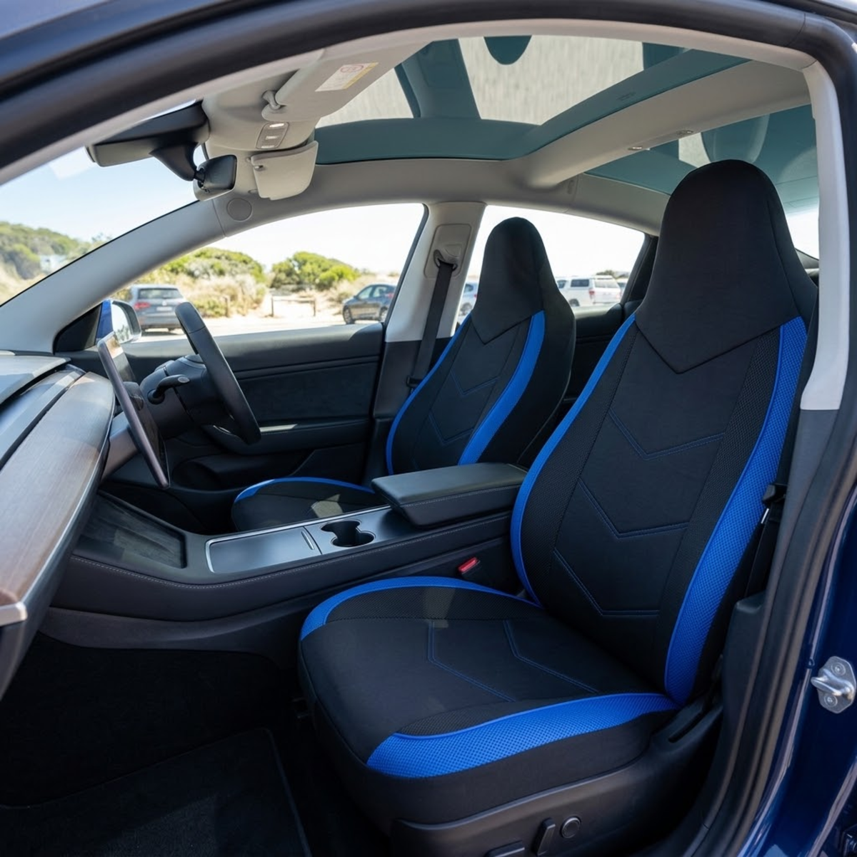 Black and blue Sport Mesh Car Seat Covers fitted to the front seats of a car interior on a sunny day