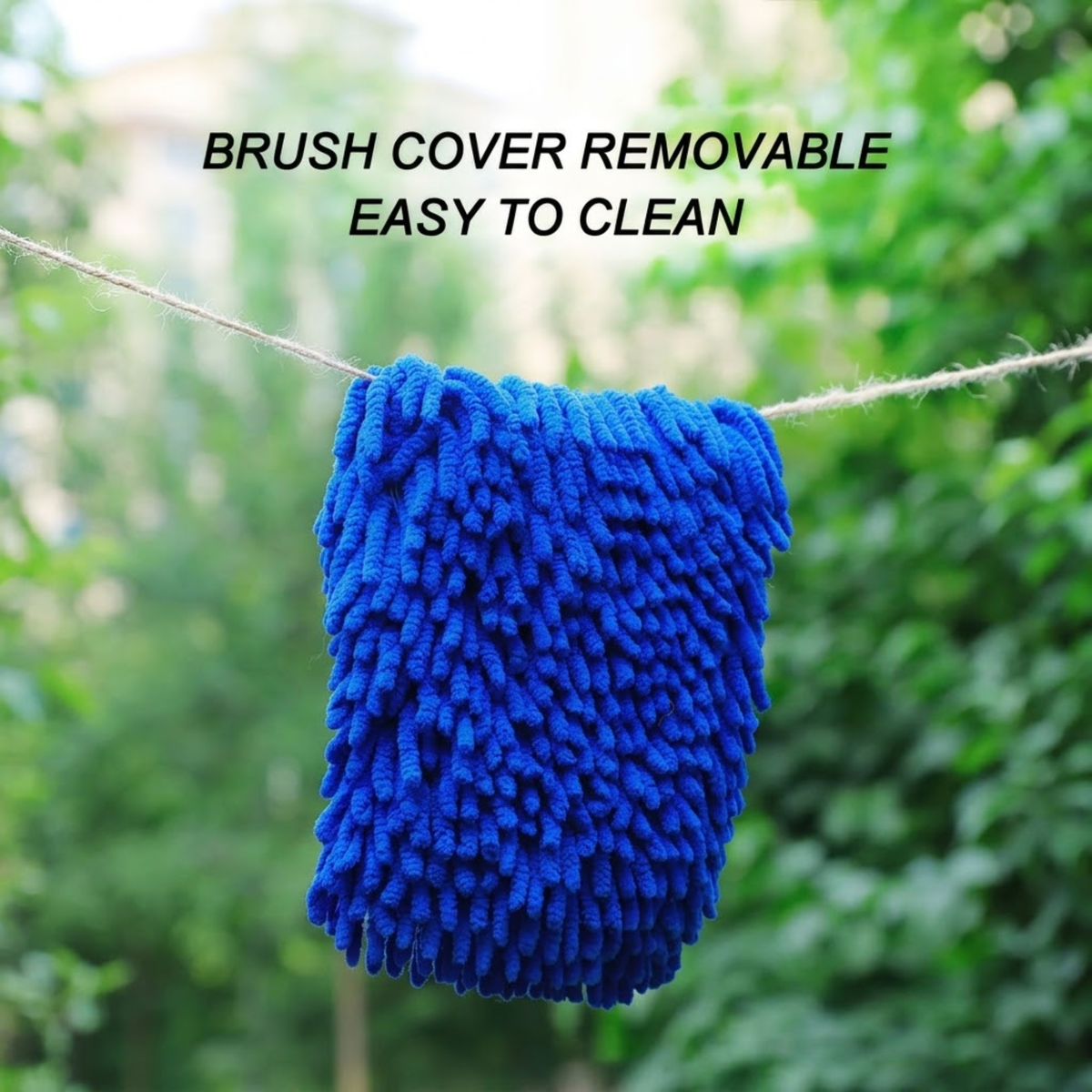 Removable blue chenille cover from the Swivel Chenille Wash Mop Kit hanging on a line to dry outdoors