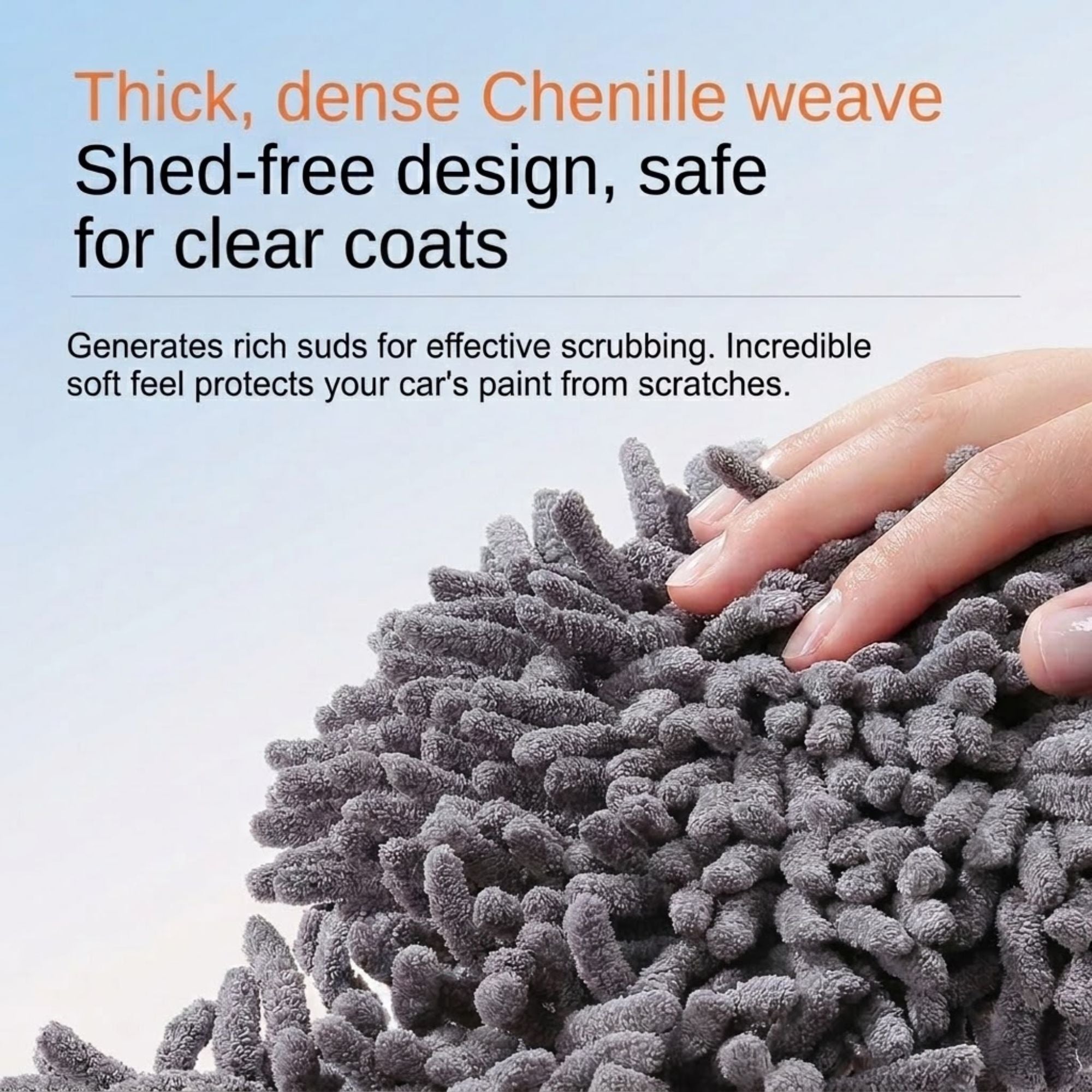 Close-up of the Telescopic Car Wash Mop's thick, dense chenille weave mop head, described as shed-free and safe for clear coats, with a hand touching the soft bristles