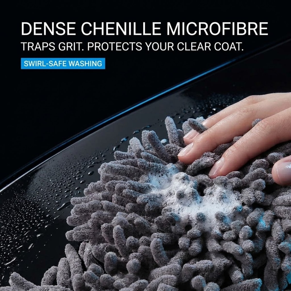Hand pressing the dense chenille microfibre head of the Telescopic Car Wash Mop onto a wet car surface