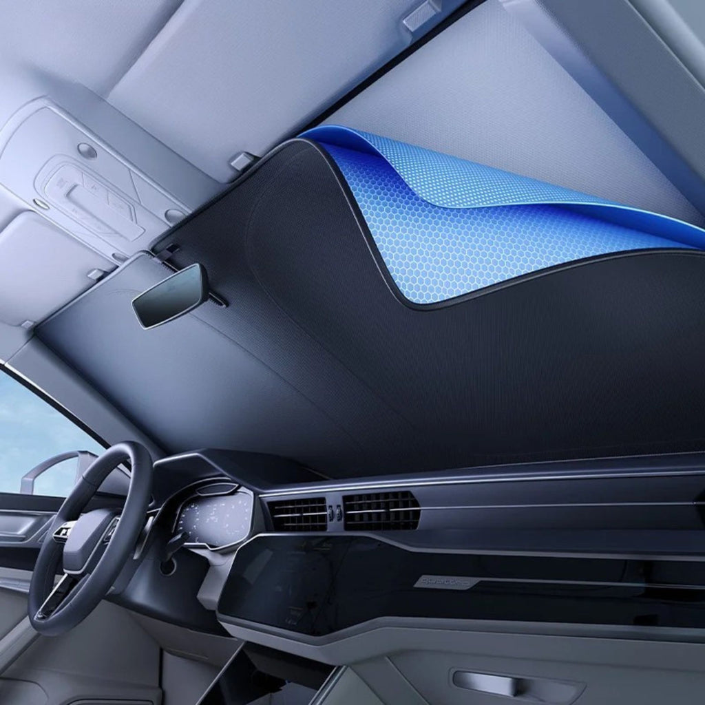 UV-Block Windscreen Sun Shade installed inside a vehicle windscreen, cabin view showing the reflective silver inner layer covering the full dashboard
