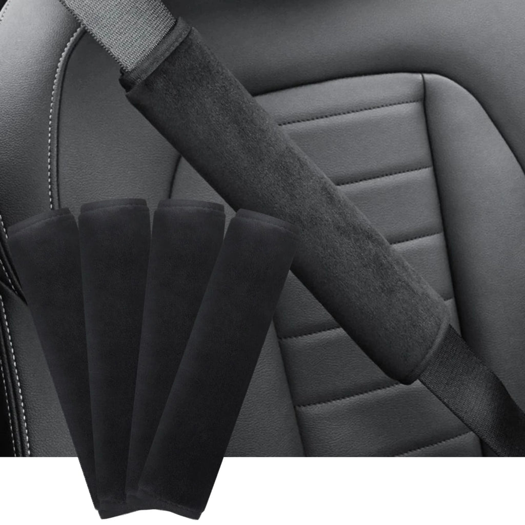Seat belt shoulder cover installed on a car seat with four black covers laid out beside the fastened belt