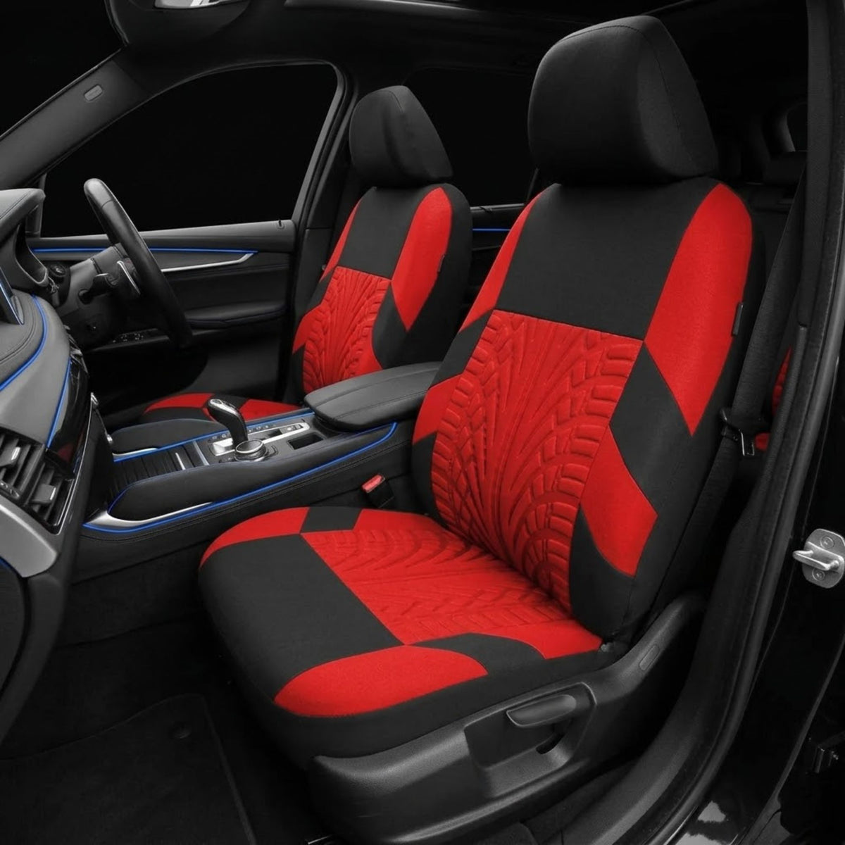 Red and black car seat covers installed on the front seats of a vehicle interior, shown with the door open and dashboard visible.