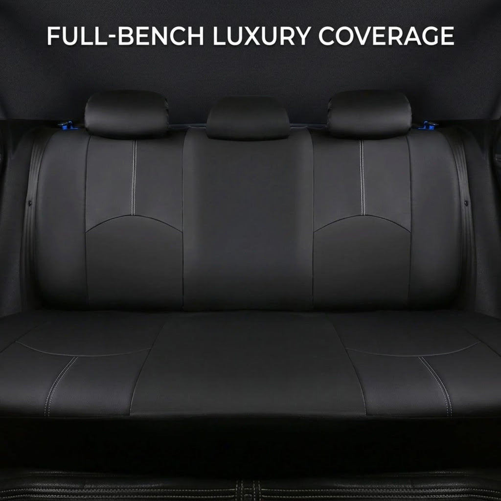 Black leather car seat cover set installed on a three-seat vehicle rear bench, with white text at the top reading 'FULL-BENCH LUXURY COVERAGE'.