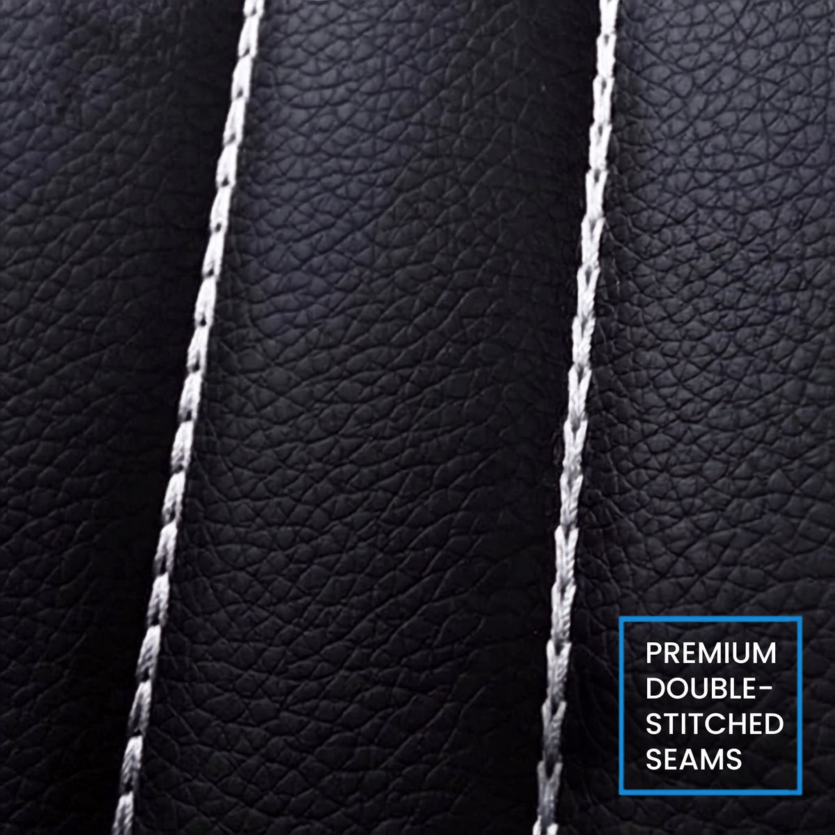 Close-up of black pebbled leather upholstery with double white stitching, plus a blue-bordered text label reading 'PREMIUM DOUBLE-STITCHED SEAMS'.