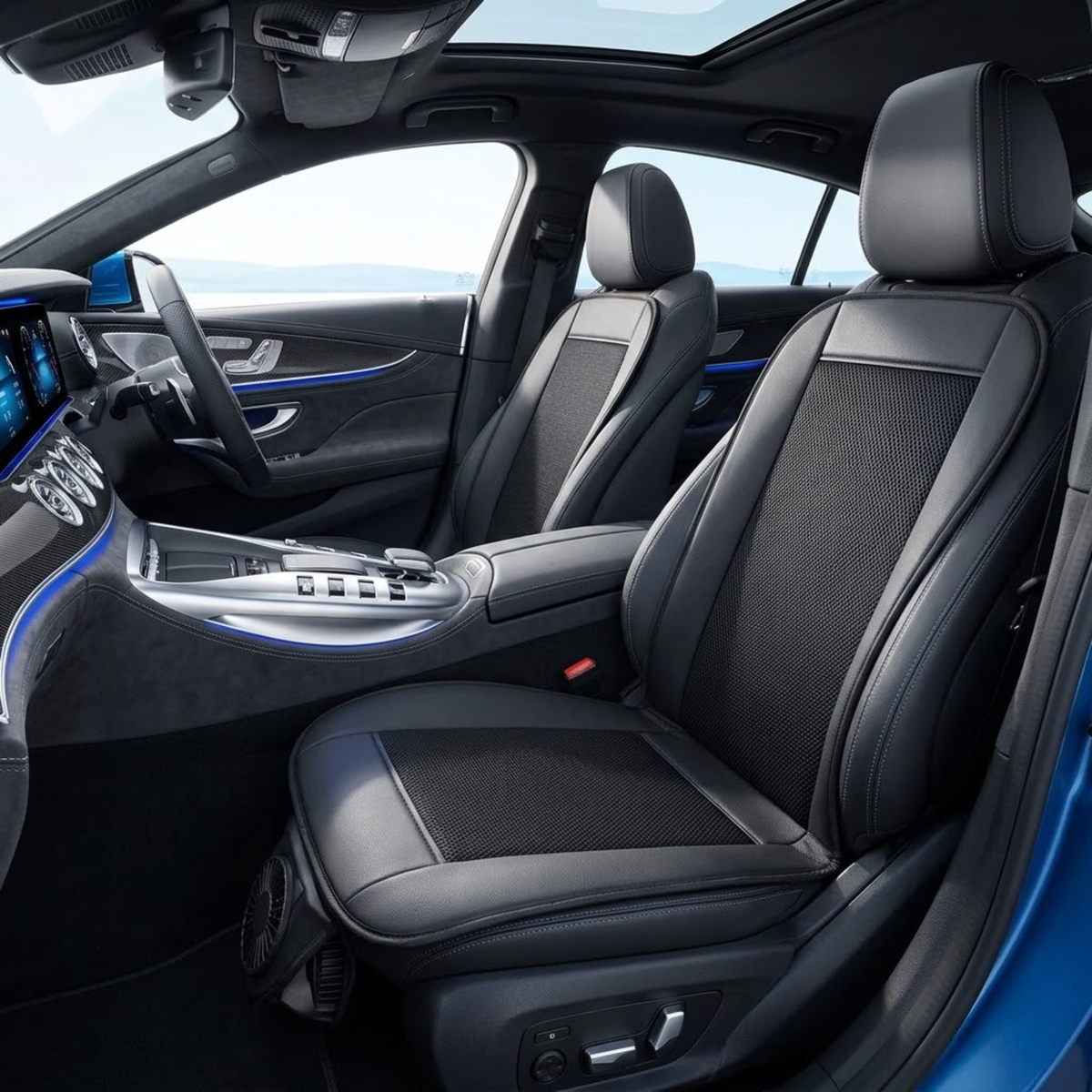 Black leather car seat covers installed on the front seats of a luxury vehicle interior, featuring a textured center panel and smooth outer upholstery.