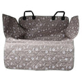 Grey quilted Waterproof Dog Cargo Liner with paw and bone print, side flaps and headrest straps on a white background