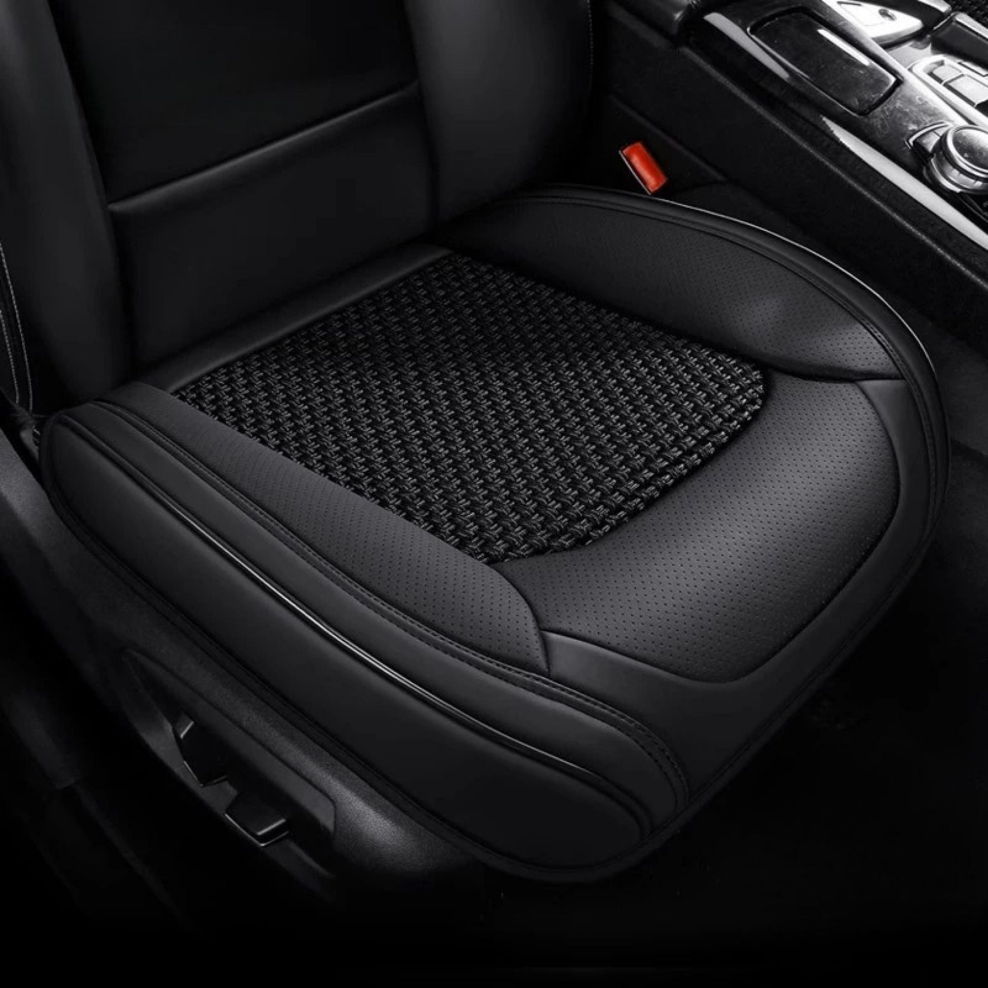 Black ice silk seat cover fitted to a car driver seat with a woven cooling mesh centre panel