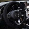Black mesh steering wheel cover fitted on car dashboard view, lightweight low-profile design