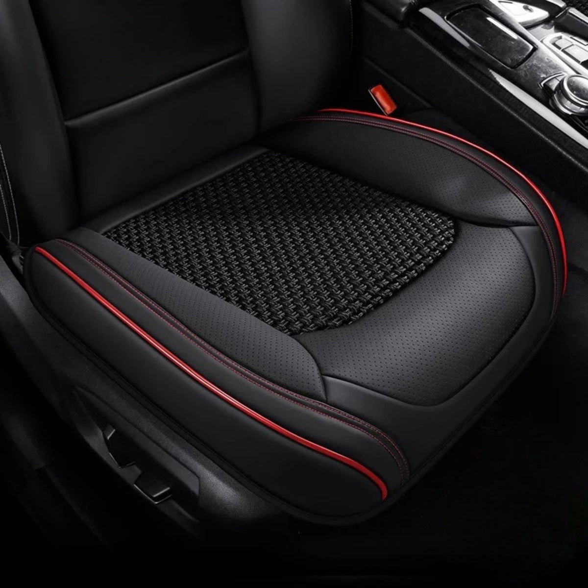 Black ice silk seat cover with red piping trim fitted to a car seat