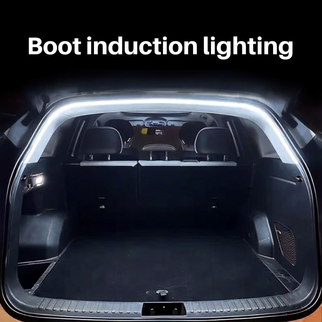 White LED boot induction light strip glowing automatically around the edge of an open car trunk at night