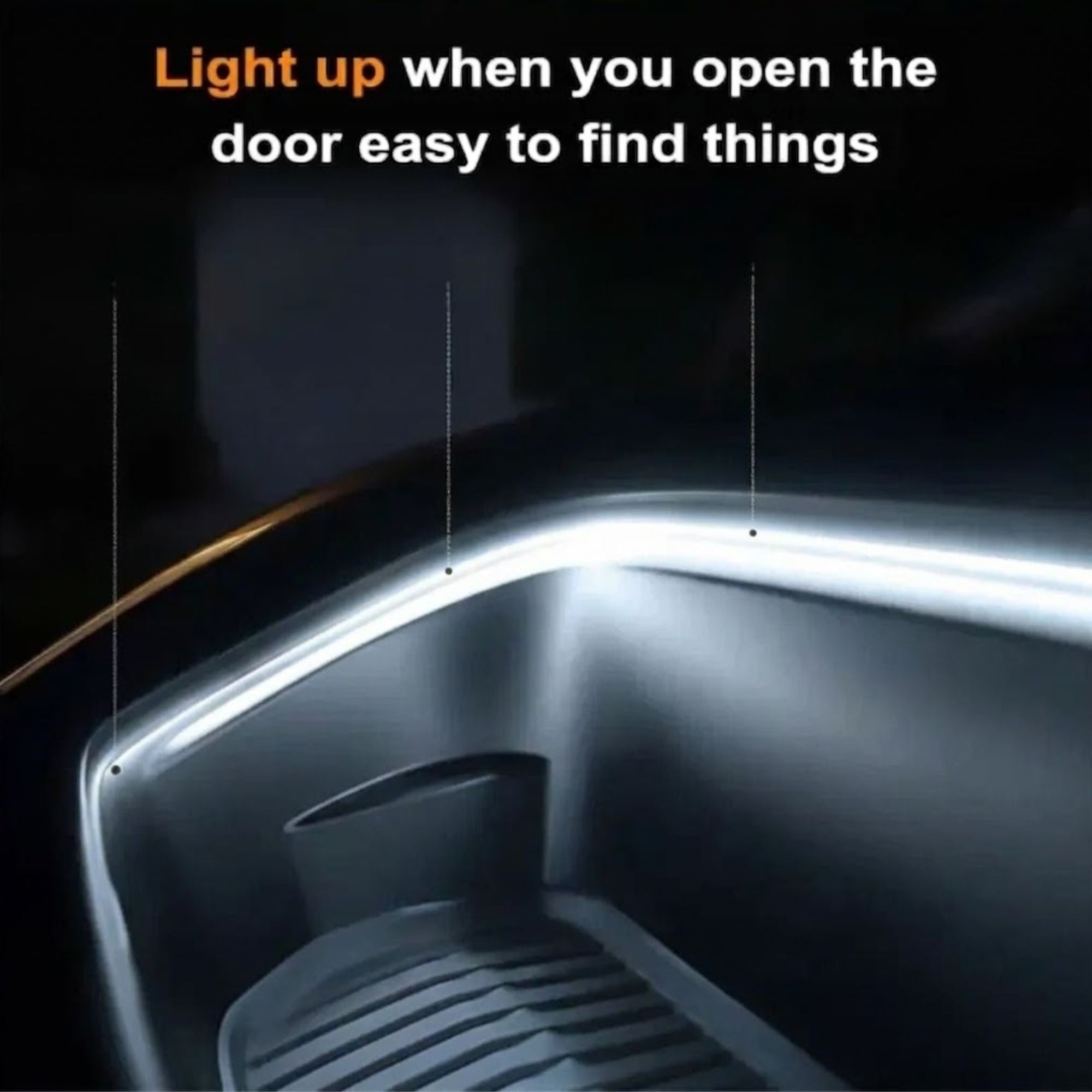 Close-up of a white LED light strip glowing along the edge of a car boot that lights up automatically when the door opens