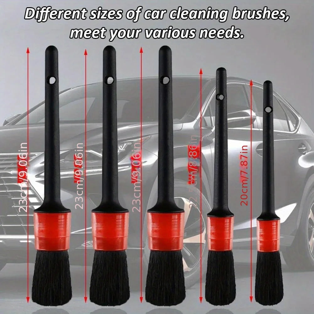 Five car detailing brushes of varying sizes arranged by length from 20.96 centimetres to 24.00 centimetres.