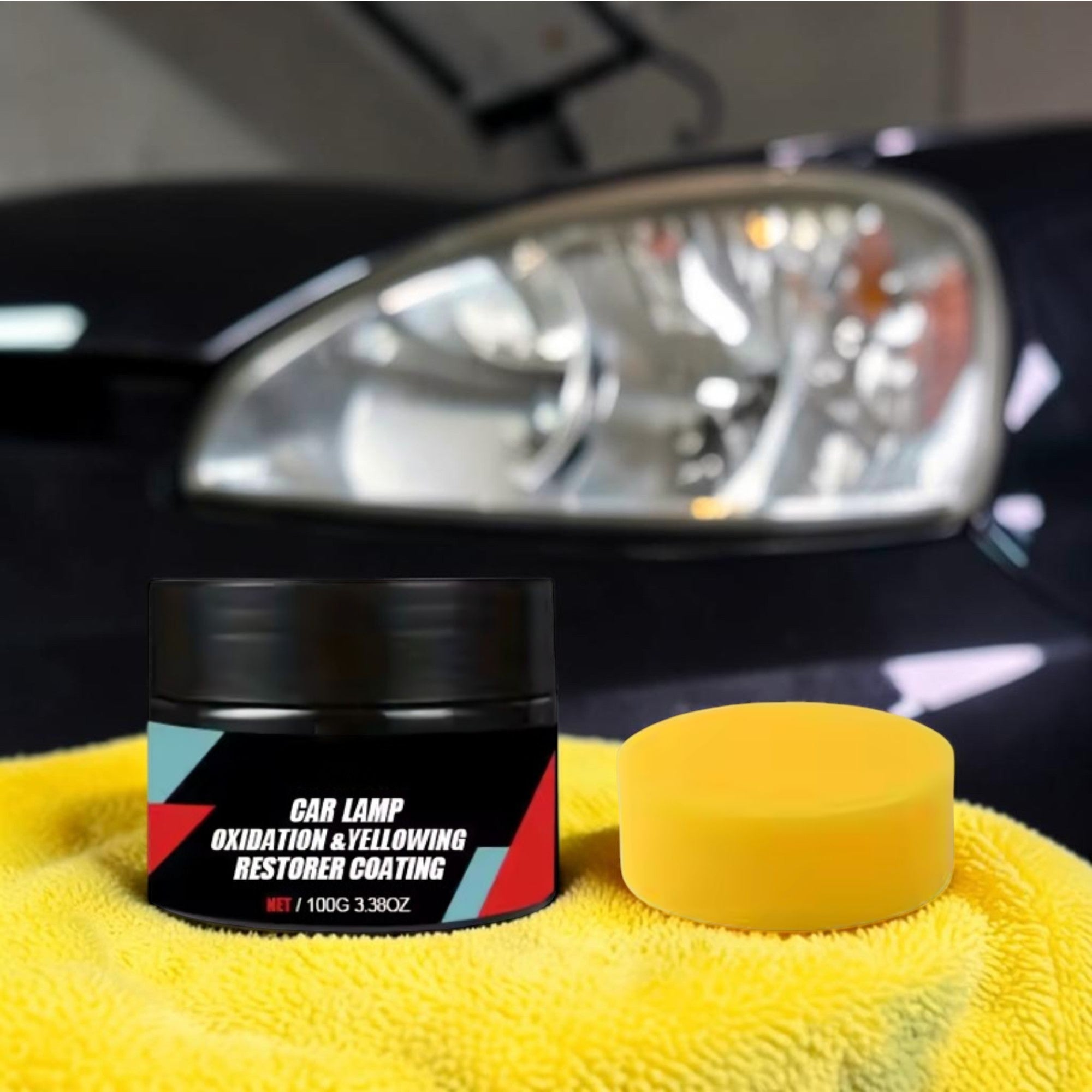 Black jar of car headlight restorer and a yellow sponge resting on a plush microfiber towel next to a crystal-clear, newly restored vehicle headlight.