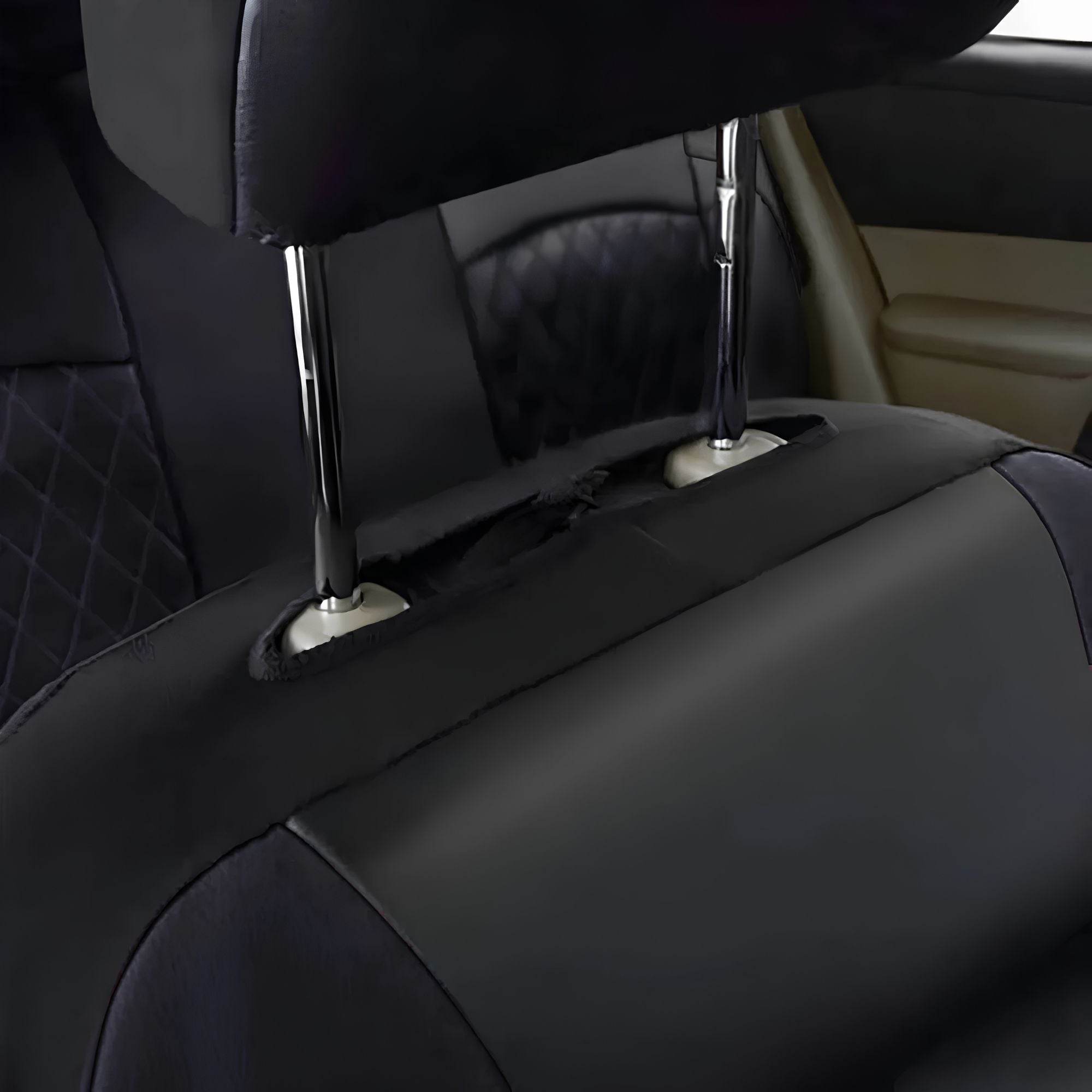 Close up view of the separate headrest cover installation, showing the fitting around the metal headrest poles.
