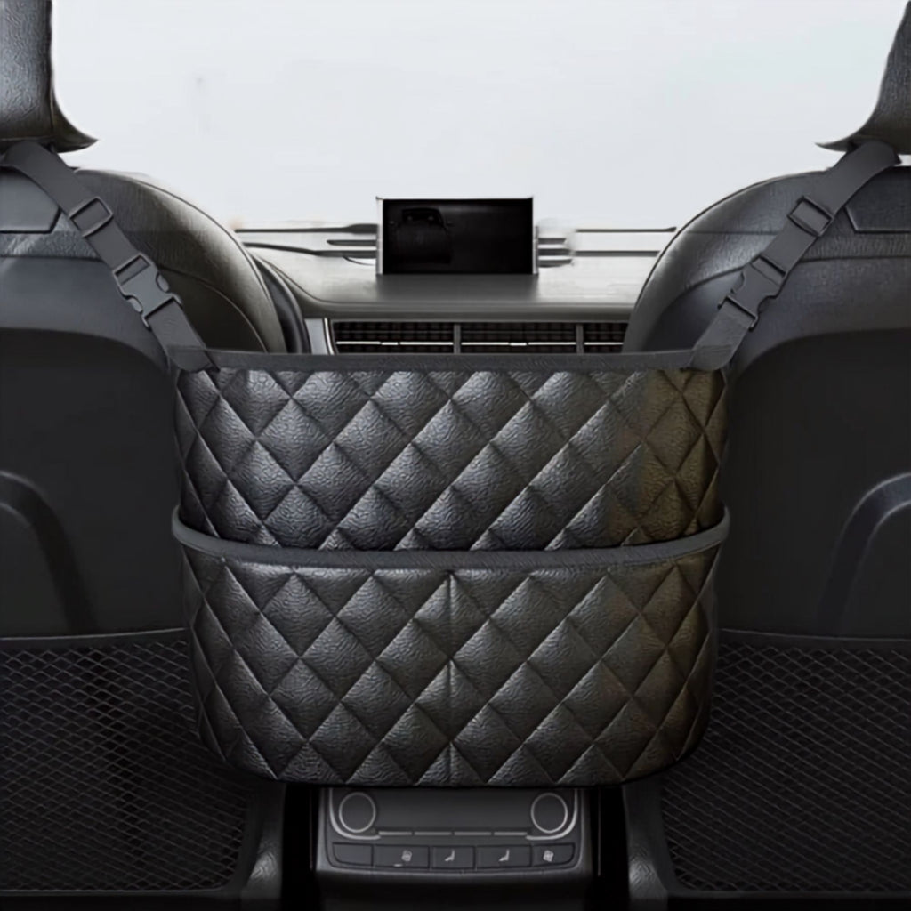 Black quilted PU leather console storage bag installed between front car seats holding a bottle and handbag