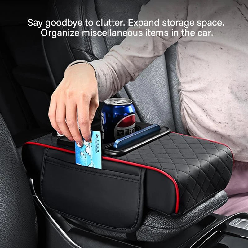 Driver placing a card into the side storage pocket of the centre console armrest cushion to organise loose cabin items.