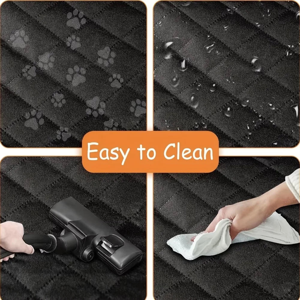 Demonstration of cleaning the quilted black dog car seat cover using a handheld vacuum cleaner and wiping the surface with a damp cloth.