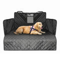 Quilted black dog car seat cover and interior boot liner installed in a vehicle cargo area with a golden retriever resting on it.