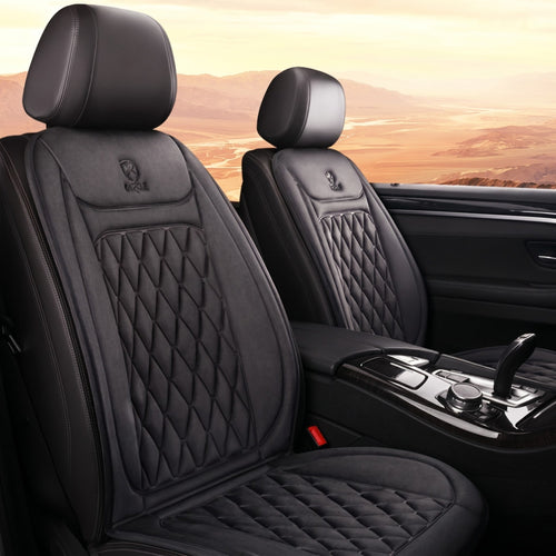 Two black quilted heated car seat covers cleanly installed on both the driver and passenger front seats of a luxury vehicle interior.